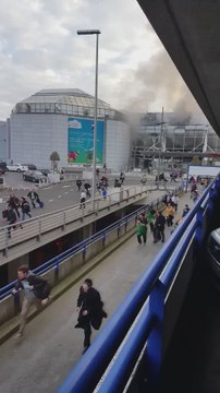 People Flee From Brussels Airport After Explosions