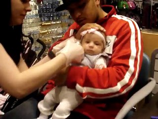 Michaela getting her ears pierced
