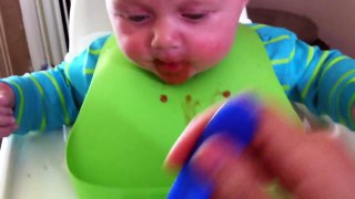 Zac eating baby food