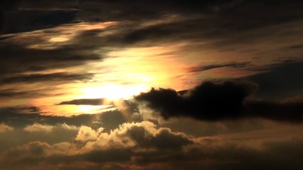 Magic cloud dragon flying through the sun