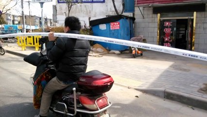 Man carries six-metre long pipe while driving a scooter