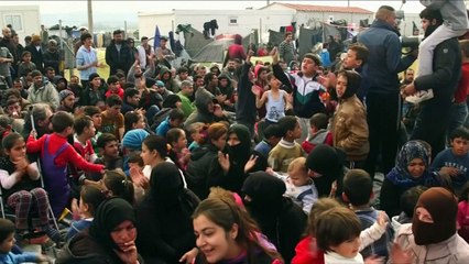 Refugees mourn with victims of Brussels attacks