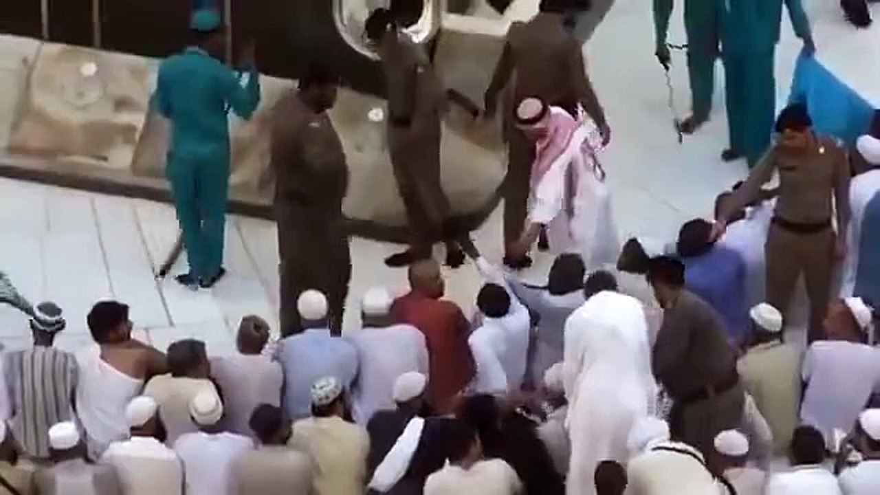 Haram security personnel helps a disabled man