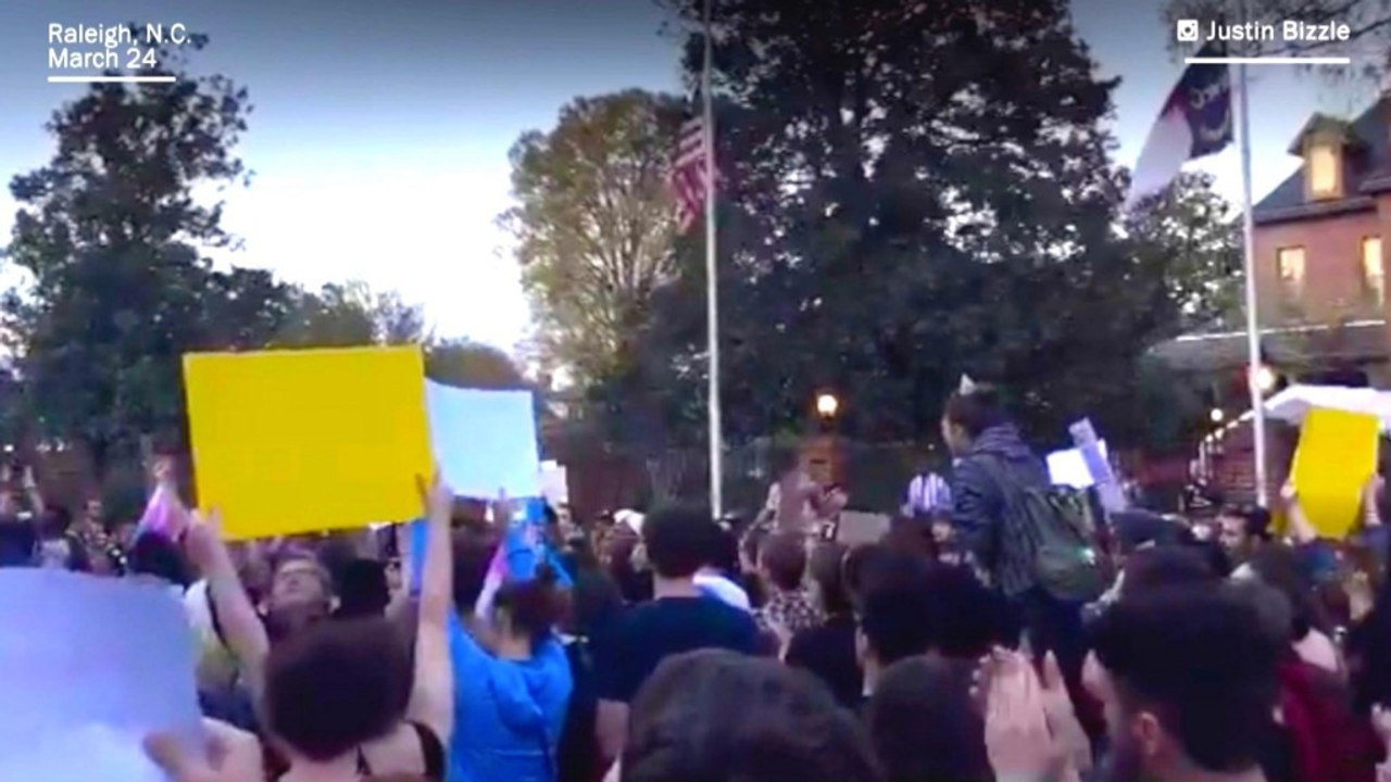 Protesters chant 'We are more than pink and blue' outside governor's mansion