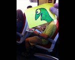 Animator draws cartoon heads on train passengers
