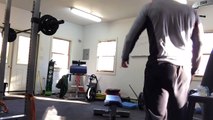Getting dumbbells into position for bench press