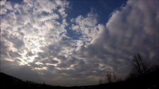 Time-lapse glimpses of sunlight during cloudy sky, Full HD