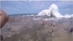 A Huge Wave takes out Swimmers