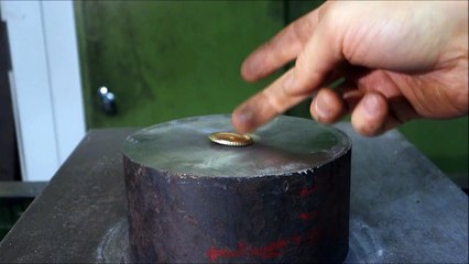 Crushing coins with hydraulic press