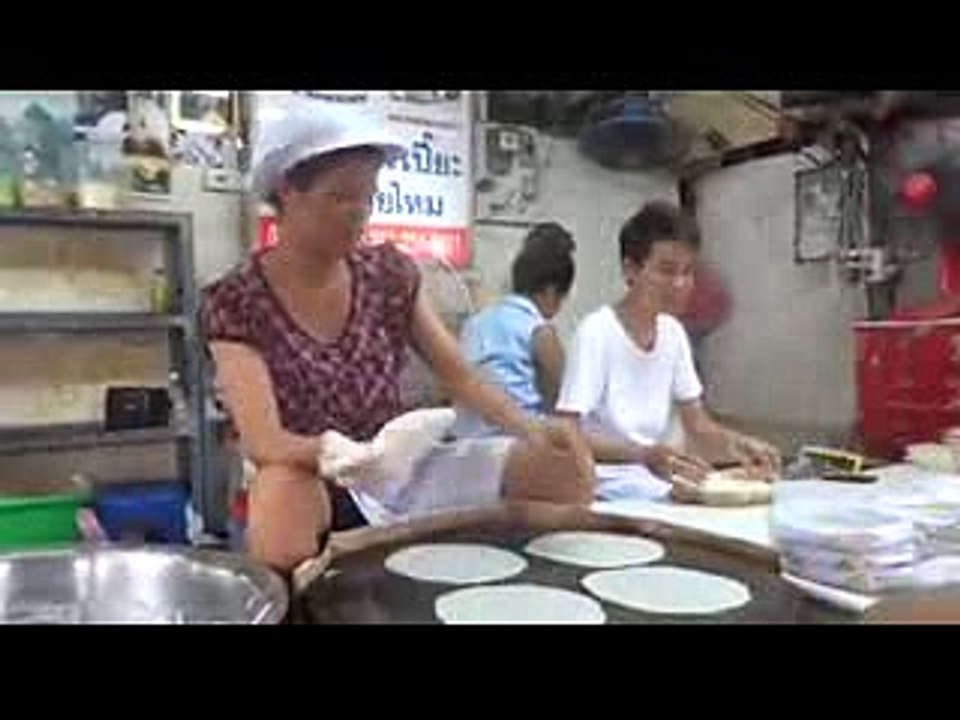 Woman Making rice pager sheets
