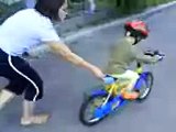 2,5 years old boy is bicycling without subsidiary bicycles