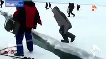 Hundreds of fishermen frantically when chunks of ice lakes in Magadan Russia cracking two separate