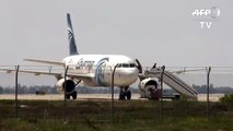 ---Hijacked Egyptian airliner in Cyprus, 2 people leave the plane