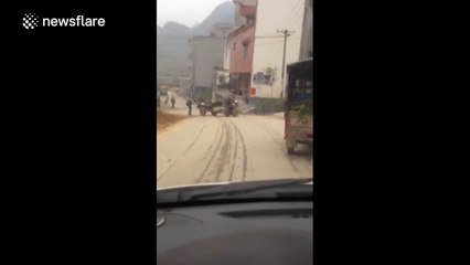 Mini tractor does doughnuts after losing driver