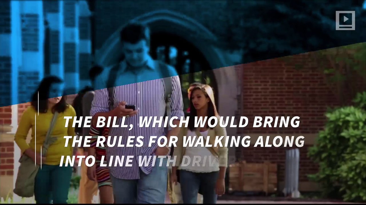 Walking while texting could soon send you to jail