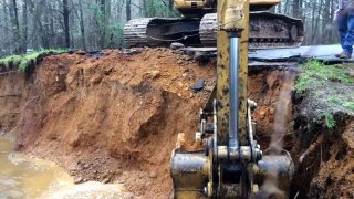 Trackhoe Rescues Car! Road Washout Accident Disaster Excavator Caterpillar