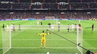A spectator at a Real Madrid game takes a penalty kick to the face