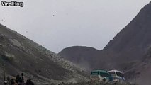 Bus passengers on the Karakoram Highway are forced to face flying boulders! Luckily, no one was injured!