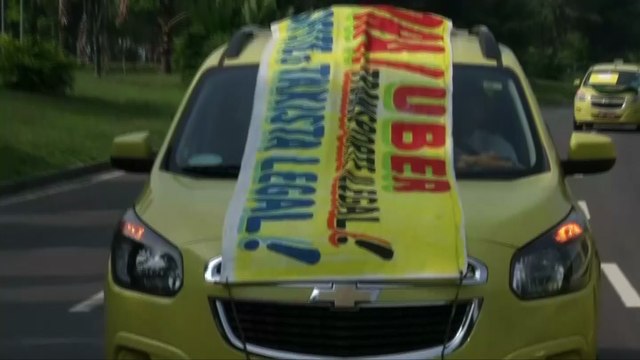 Rio taxi drivers protest Uber