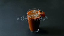 Glass of Tomato Juice Decorated With Slice Tomato