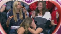 Cette fille mangeant une pizza a volé la vedette lors d'un kiss cam
