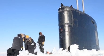US Nuclear Submarine Surfaces through Ice in the Arctic Ocean