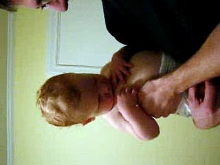 Baby trying to breastfeed on himself