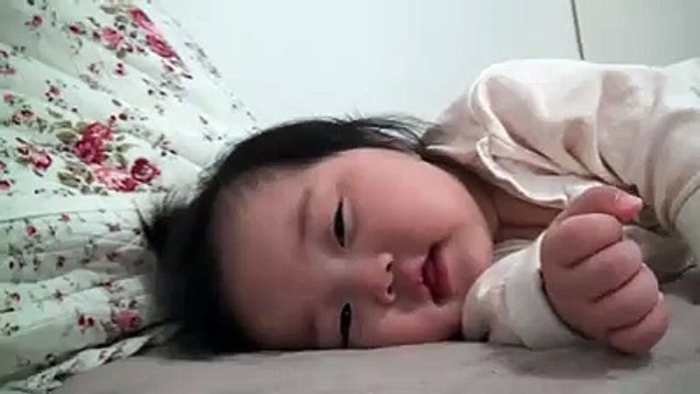 Sleeping and smiling baby