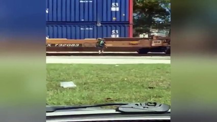 Jimmy John's Delivery Bicyclist Jumps A Moving Train