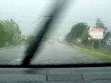 Thunderstorm with lightning and little hail in heavy rain wrapped