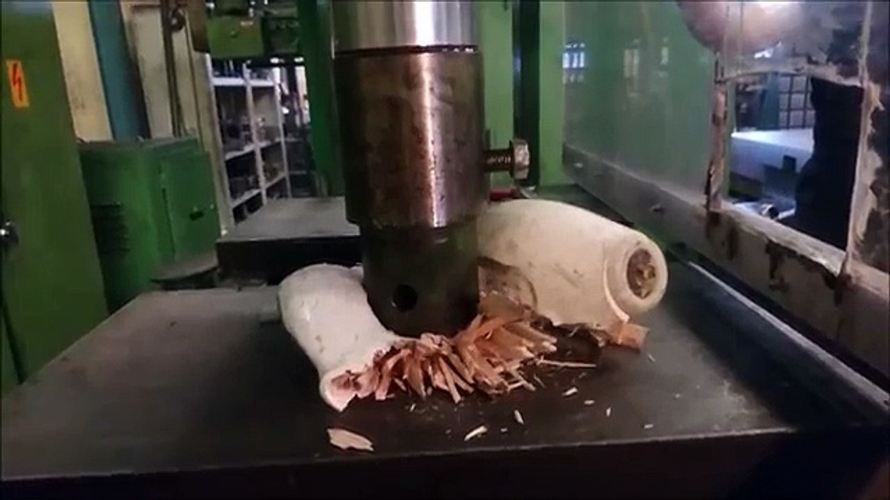 Crushing bowling ball and pin with hydraulic press