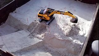 Bruder RC Cat Excavator excavation with sand