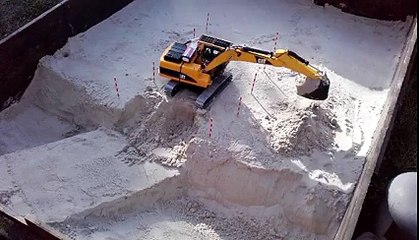 Bruder RC Cat Excavator excavation with sand