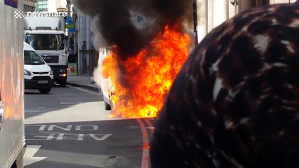 Van burns on London's Cornhill before exploding