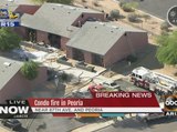 Condo fire destroys two homes in Peoria