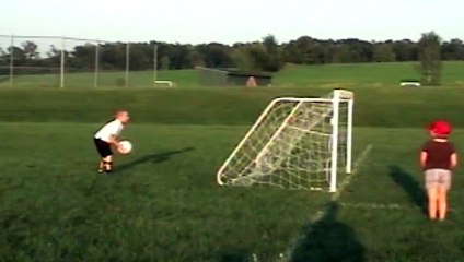 Kid Kicks Soccer Ball into his Own Face