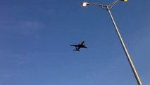 Plane flying over freeway at Chicago O'Hare airport