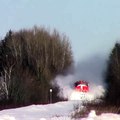 Train plows through snow bank.