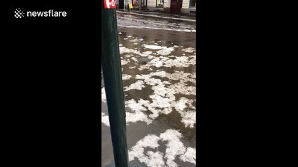Flooding in Oslo, Norway causes mini whirlpool effect on road