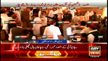 Members of PTI and JUI fight during the mayor's oath taking ceremony