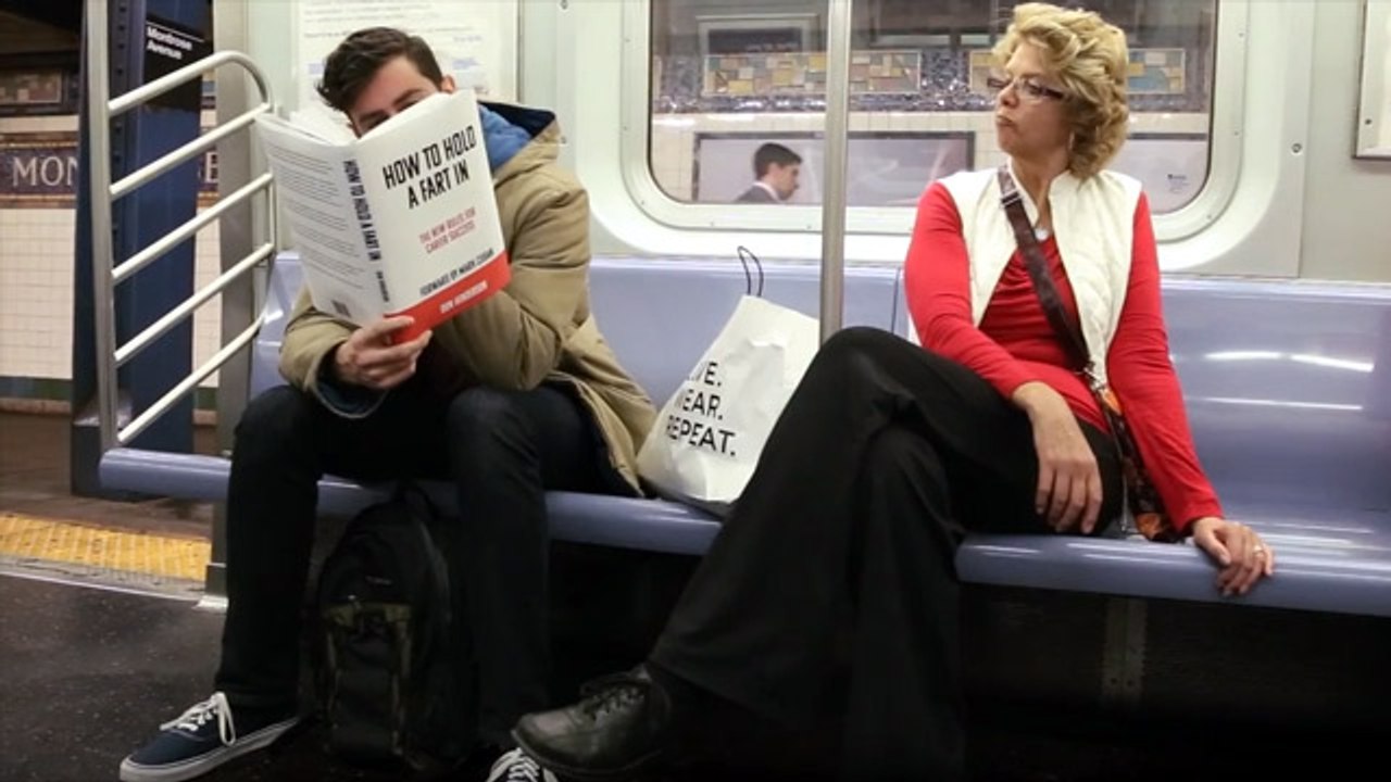 Funny! Prankster Reads Books With Fake Covers On Subway