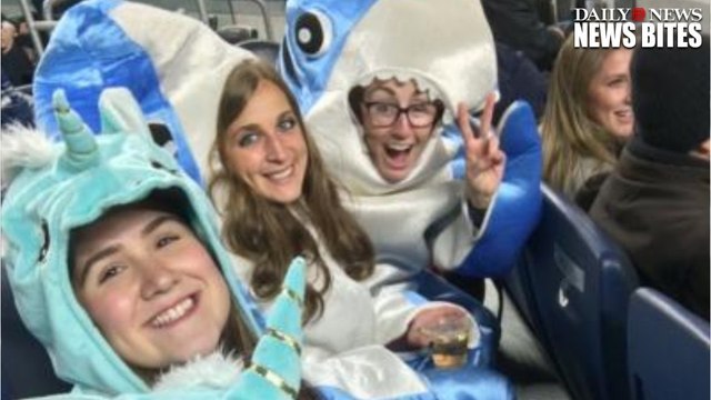 John Oliver Contest Winners At The Yankees Game Wear Unicorn & Shark Outfits