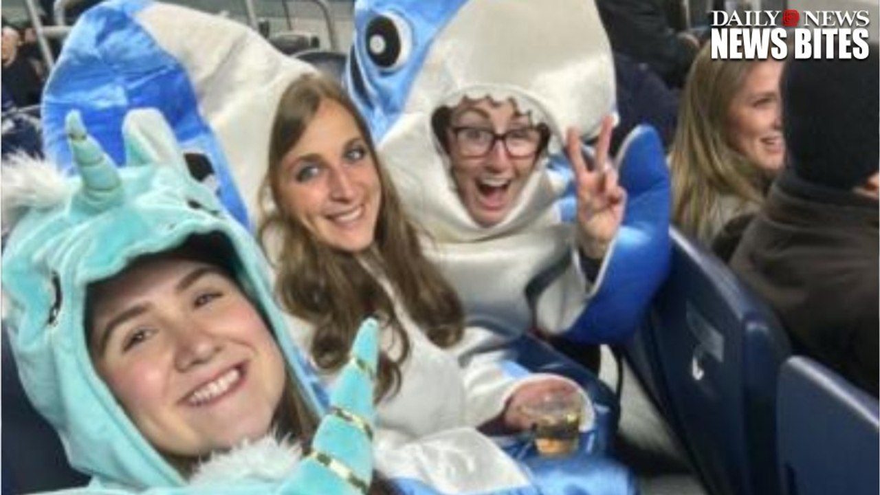 John Oliver Contest Winners At The Yankees Game Wear Unicorn & Shark Outfits