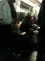 Two girls fighting on the three train