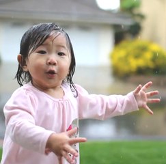 This little girl discovers the rain