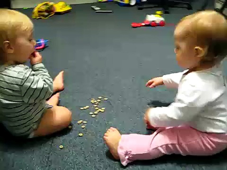 Twin Babies Feeding Each Other