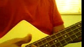 headless bass player in red