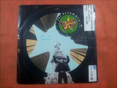 JOE STRUMMER & THE LATINO ROCKABILLY WAR.(THEME FROM PERMANENT RECORD.)(12''.)(1988.)