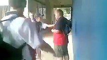 student knock down boy