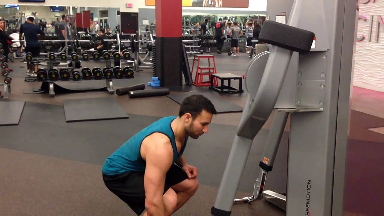 How To Do The Standing One-Arm Cable Curl - Male Fitness Training Video - FxFitness.ca